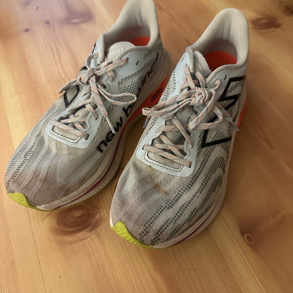 New Balance Athletic Shoes with Gray and Orange Accents